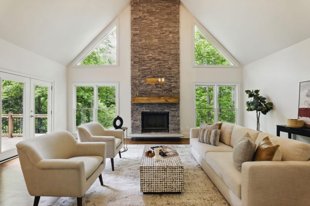 Great room with stone fireplace in a custom home built by VIBE Luxury Homes in Asbury Park, Atlanta