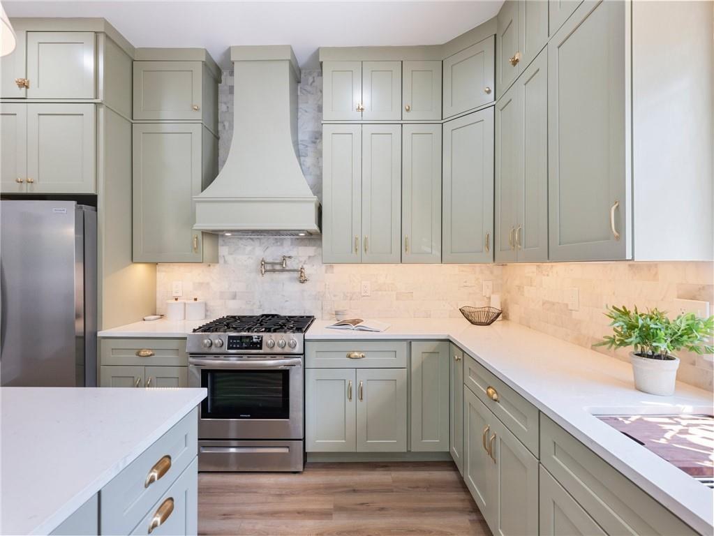 Range wall with plaster hood and pot filler, Dill custom home