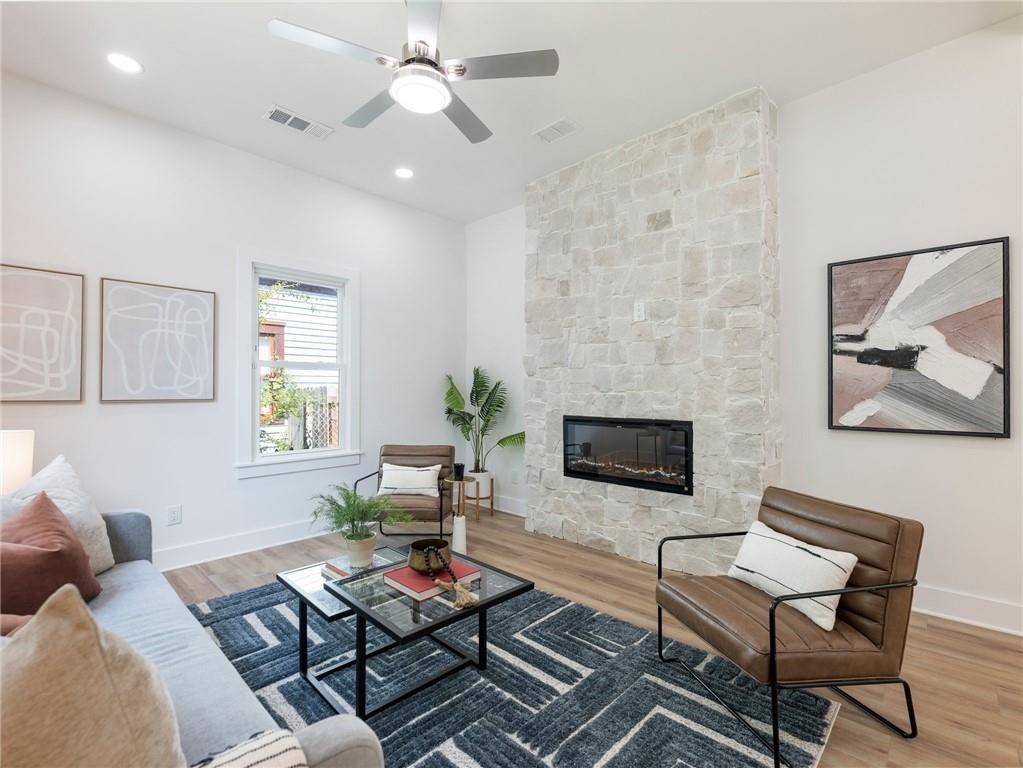 Living room with stacked stone fireplace, Dill custom home
