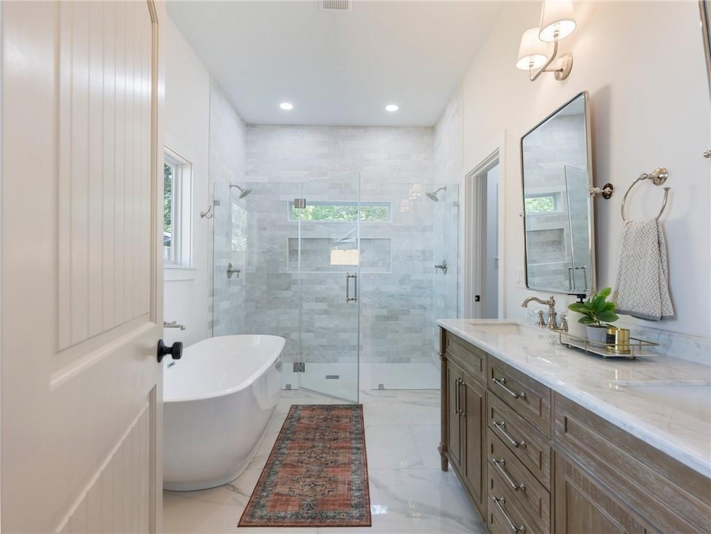 Primary bathroom with marble tile, Dill custom home