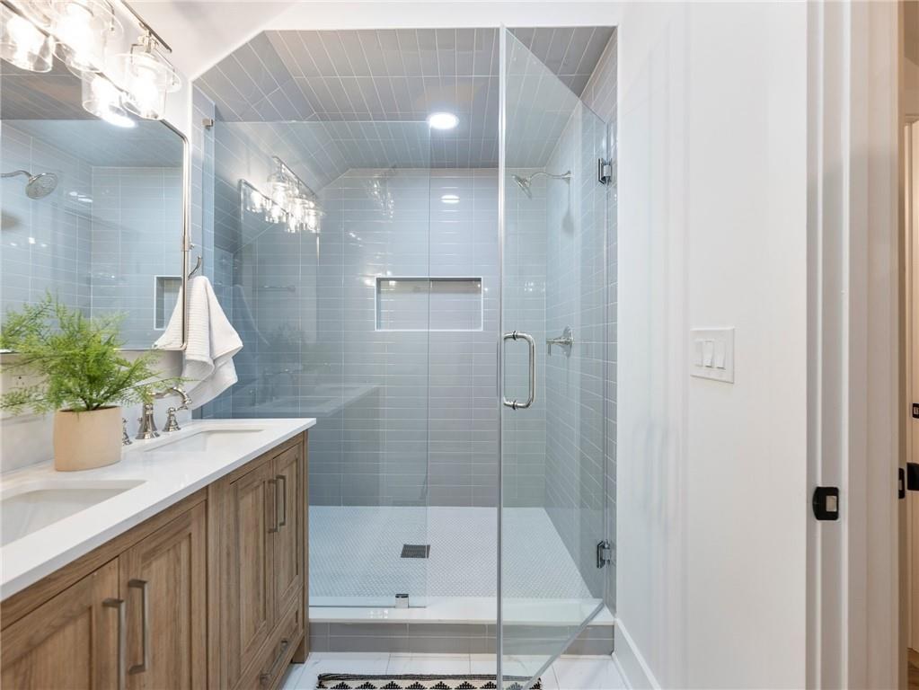 Guest bathroom with blue tile shower, Dill custom home
