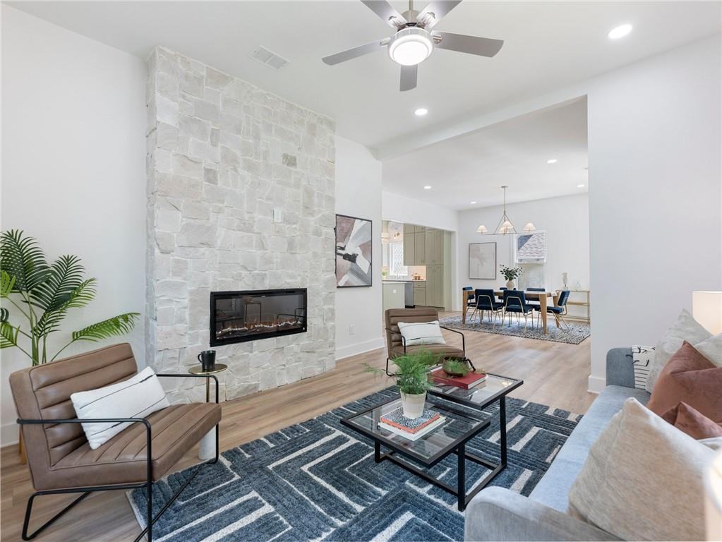 Living room stone fireplace in a bungalow renovation by VIBE Luxury Homes in Atlanta’s West End