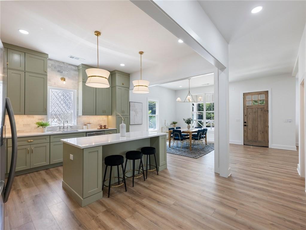 Kitchen looking toward the dining room in a bungalow renovation by VIBE Luxury Homes in Atlanta’s West End