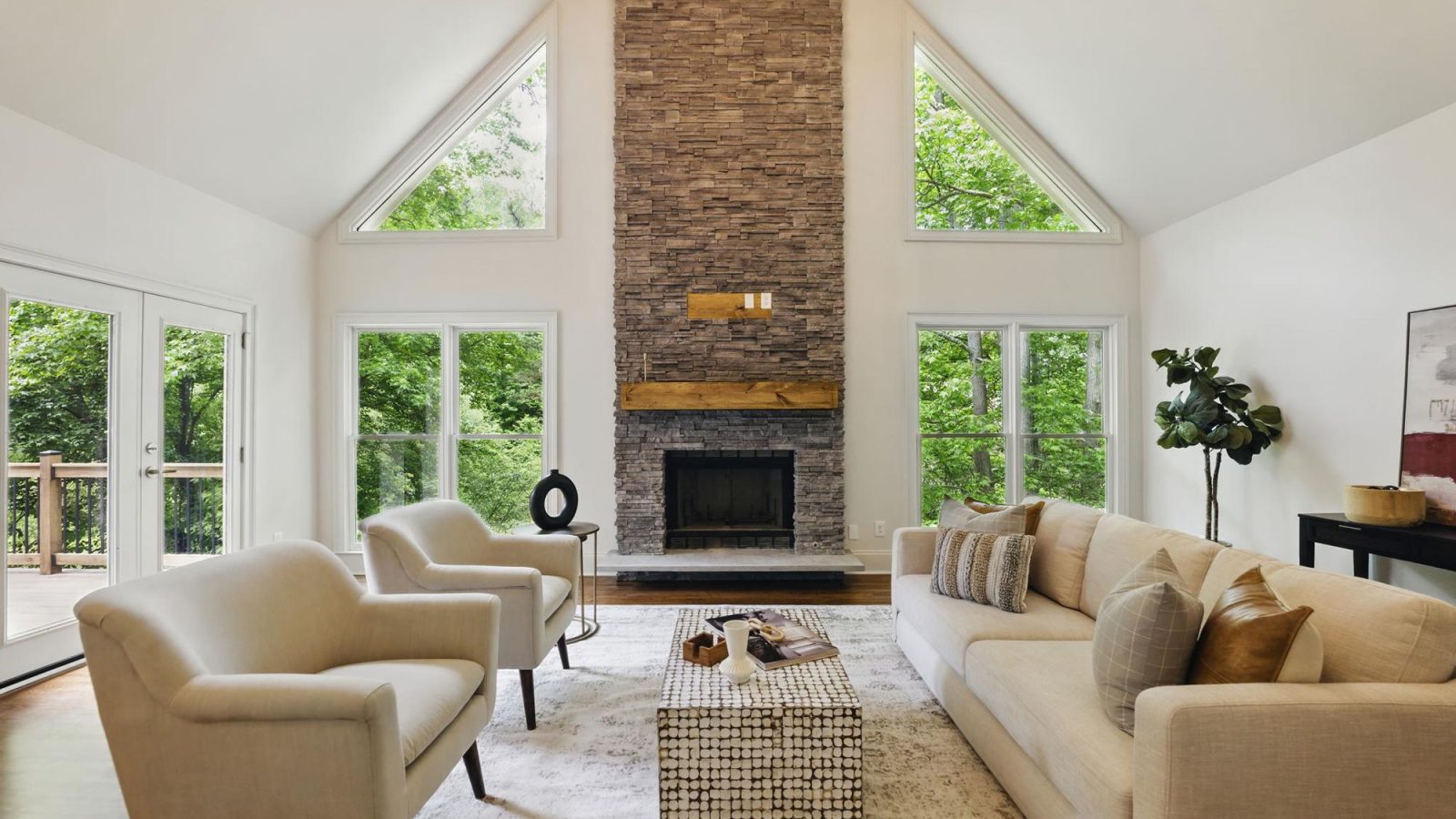 Great room with stone fireplace in a custom home built by VIBE Luxury Homes in Asbury Park, Atlanta
